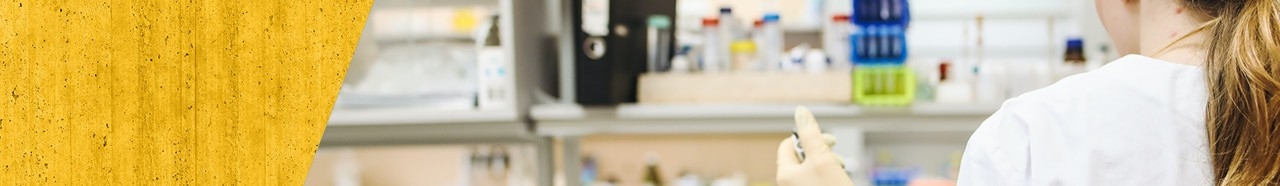 Student working inside chemistry lab.