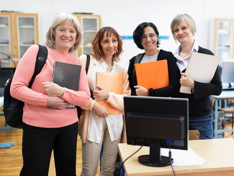 Sociology students smiling together in classroom